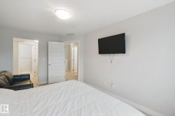 Recessed ceiling light, paneled interior door, and light-toned wall paint - 