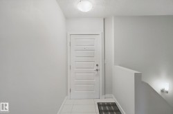 White paneled door with contemporary hardware - 
