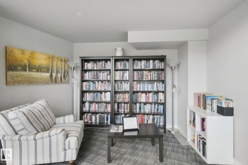 Recessed ceiling lighting, full-height shelving, and wall-to-wall carpeting - #125 5151 Windermere Bv Sw Sw, Edmonton, AB 