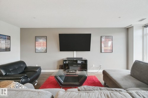 Recessed ceiling lighting, wood-finish flooring, and expansive windows - #125 5151 Windermere Bv Sw Sw, Edmonton, AB 