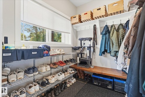 Built-in shelving, wood-finish bench, and window with natural light - #45 53122 Rge Road 14, Rural Parkland County, AB 