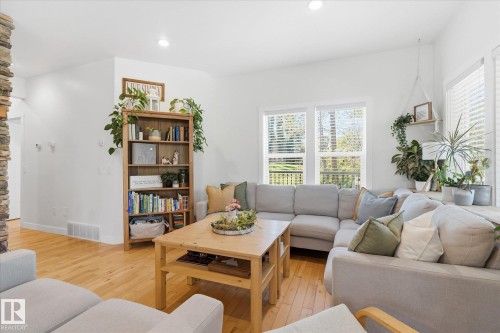 Light wood-finish flooring, recessed lighting, white walls, and multiple windows - #45 53122 Rge Road 14, Rural Parkland County, AB 