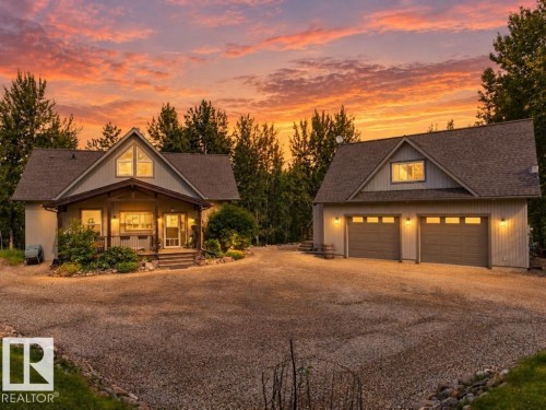 Main residence with covered porch and a detached two-car garage - #45 53122 Rge Road 14, Rural Parkland County, AB 
