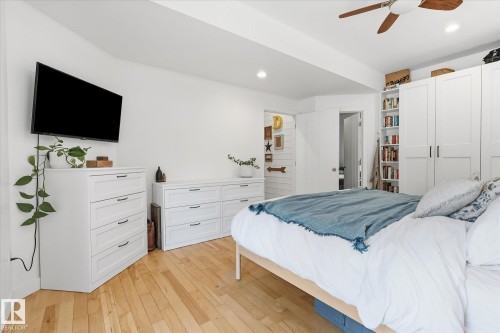 Hardwood-style flooring, recessed lighting, ceiling fan, and built-in shelving - #45 53122 Rge Road 14, Rural Parkland County, AB 