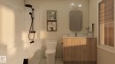 Bathtub with matte black shower fixtures, wood-finish vanity with countertop, rectangular wall mirror, and window with white trim - 2616 62 Street Sw, Edmonton, AB 