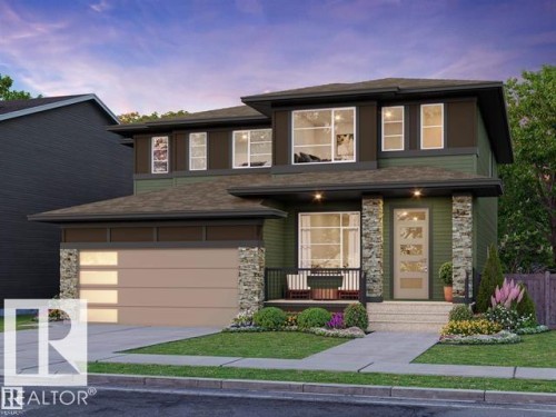 Contemporary exterior with green siding and stone accents, featuring a multi-pane garage door, front porch with railings, and established landscaping - 2616 62 Street Sw, Edmonton, AB 