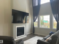 Integrated fireplace feature with white surround - 