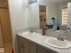Double vanity with built-in sinks and chrome fixtures - 