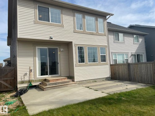 Rear exterior with horizontal siding and multiple window banks - 7939 Erasmus Crescent Nw, Edmonton, AB 
