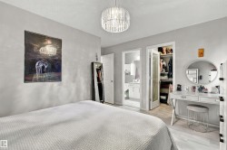 Recessed lighting, wood-finish flooring, and a crystal chandelier - 