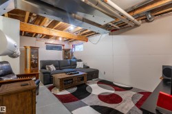 Exposed ceiling joists and ductwork, finished drywall walls, and concrete flooring - 