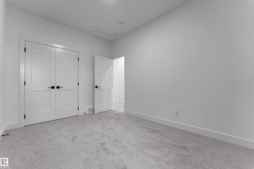 Light gray carpeting, white walls, and white trim - 794 Bank Drive, Leduc, AB 