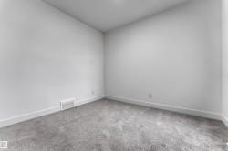 Neutral wall finishes and gray carpet - 