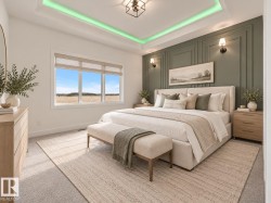 Tray ceiling with integrated lighting, paneled accent wall, dual wall sconces, ceiling-mounted light fixture, and large window with roller shades - 