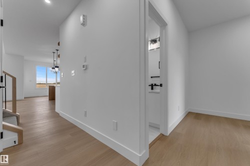 Hardwood-style flooring throughout - 794 Bank Drive, Leduc, AB 