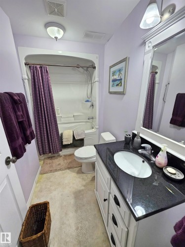 Full bathroom with a tub/shower combination - 9131 Township Road 554, Rural St. Paul County, AB 