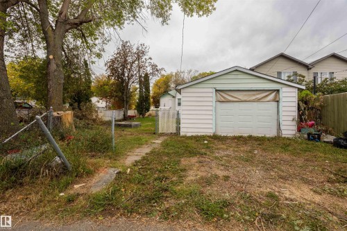Detached garage featuring a paneled door - 12707 73 Street Nw, Edmonton, AB 