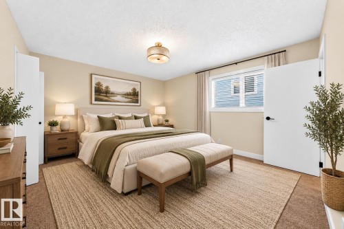 Warm neutral wall tones, recessed window with white blinds, contemporary ceiling light fixture, wood-finish nightstands with drawer storage - 7307 152C Avenue Nw, Edmonton, AB 