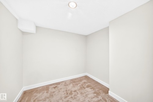 Recessed ceiling lighting, light neutral wall paint, white trim, and a low-pile carpet - 7307 152C Avenue Nw, Edmonton, AB 