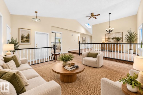 Vaulted ceiling, skylight, ceiling fan, and built-in railing - 7307 152C Avenue Nw, Edmonton, AB 