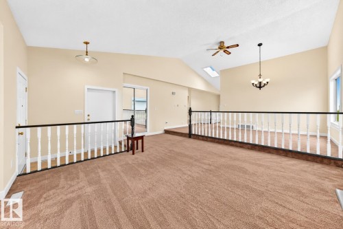 Vaulted ceiling with a skylight, ceiling fan, and recessed lighting - 7307 152C Avenue Nw, Edmonton, AB 