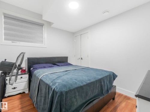 Wood-finish flooring with white walls and trim - 120 38 Street Sw, Edmonton, AB 