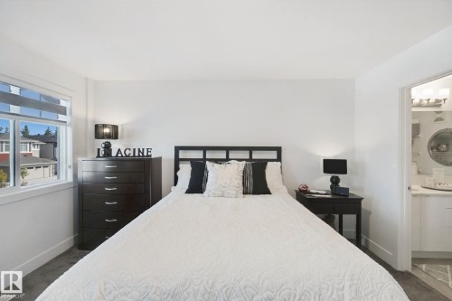White walls, gray carpet, and a window with blinds - 153 Cavanagh Common Sw, Edmonton, AB 