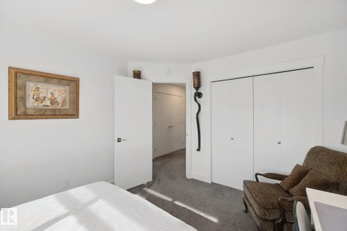 Recessed ceiling lighting, white interior doors, and bi-fold closet doors - 153 Cavanagh Common Sw, Edmonton, AB 