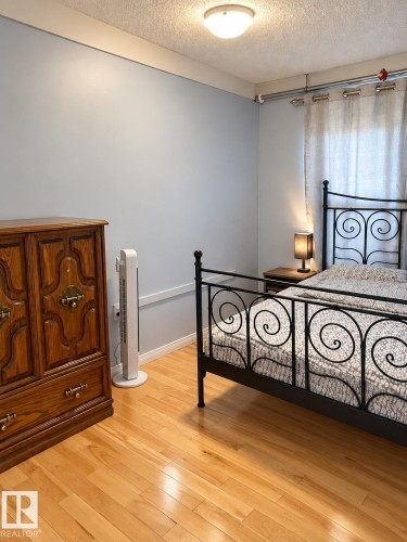 Hardwood flooring, light blue wall paint, and overhead flush-mount lighting - 18929 99A Avenue Nw, Edmonton, AB 