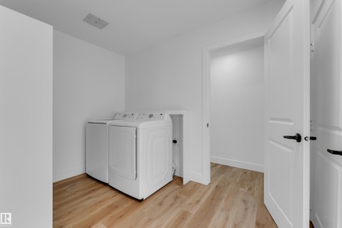 Wood-finish flooring with white walls and trim - 52314 Rge Road 215, Rural Strathcona County, AB 