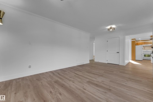 Wood-finish flooring, white walls, and a contemporary ceiling light fixture - 52314 Rge Road 215, Rural Strathcona County, AB 