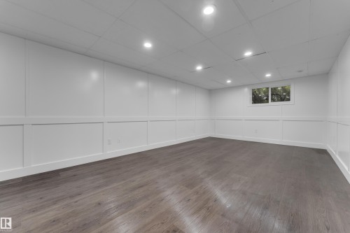 Wood-finish flooring, recessed lighting, and a drop ceiling - 52314 Rge Road 215, Rural Strathcona County, AB 