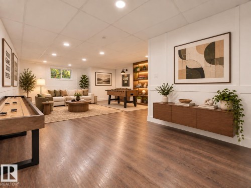 Expansive room featuring wood-finish flooring, recessed lighting, and a window for natural light - 52314 Rge Road 215, Rural Strathcona County, AB 