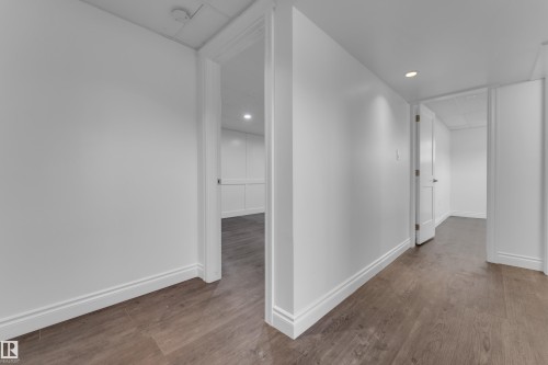 Wood-finish flooring, recessed lighting, white walls, white trim, and interior doors - 52314 Rge Road 215, Rural Strathcona County, AB 