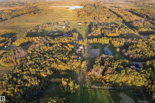 Expansive natural landscape featuring lush trees, open fields, and multiple bodies of water - 52314 Rge Road 215, Rural Strathcona County, AB 
