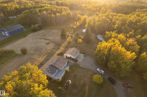 Expansive property featuring a primary residence, a secondary building, and mature trees - 52314 Rge Road 215, Rural Strathcona County, AB 