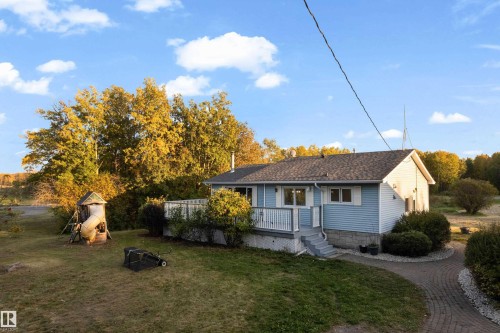Light blue siding exterior with a dark shingle roof - 52314 Rge Road 215, Rural Strathcona County, AB 