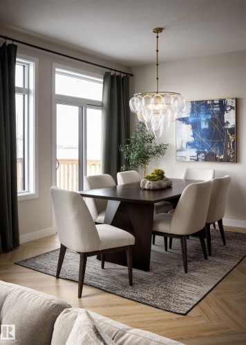 Wood-finish flooring, contemporary chandelier, and large sliding glass door - 16 Clichy Close, St. Albert, AB 