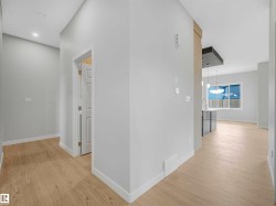 Light-toned wood-finish flooring throughout - 