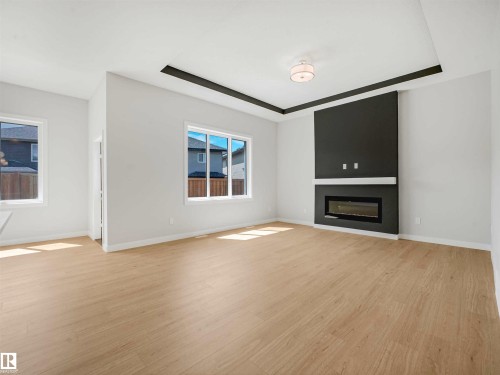 Recessed ceiling detail with an attached flush-mount light fixture - 22 Dalquist Bay, Leduc, AB 