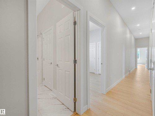 Recessed ceiling lighting, paneled interior doors, and light wood-finish flooring - 22 Dalquist Bay, Leduc, AB 