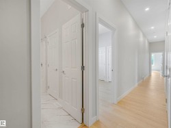 Recessed ceiling lighting, paneled interior doors, and light wood-finish flooring - 