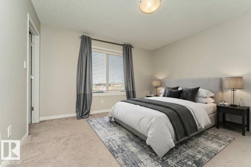 Soft gray wall paint, textured ceiling, light-colored carpeting, window with blinds, and white trim - 3203 Carpenter Landing Sw, Edmonton, AB 
