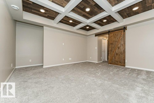 Coffered ceiling with wood-finish panels and recessed lighting - 3203 Carpenter Landing Sw, Edmonton, AB 