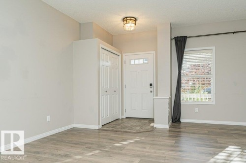 Wood-finish flooring throughout - 3203 Carpenter Landing Sw, Edmonton, AB 