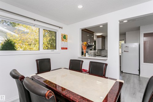 Recessed ceiling lighting, white walls, and wood-finish flooring - 7204 92B Avenue Nw, Edmonton, AB 