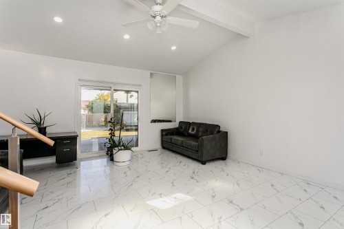 Vaulted ceiling with exposed beam, recessed lighting, and ceiling fan - 7204 92B Avenue Nw, Edmonton, AB 