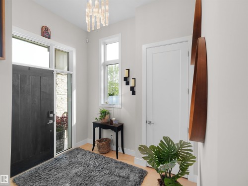 Dark-toned entry door with sidelight and transom window - 904 Wood Place Nw, Edmonton, AB 