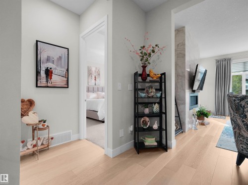 Light wood-finish flooring throughout, offering a bright and cohesive aesthetic - 904 Wood Place Nw, Edmonton, AB 