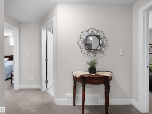 Light-toned wall paint and white trim details - 904 Wood Place Nw, Edmonton, AB 